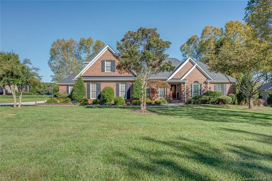 Country Club living at its best!  This level lot with professional landscape gives you both privacy and big views of the 17th hole at Gaston Country Club. Custom built ranch with split bedroom plan has wonderful layout.  So much to love with curb appeal, vaulted ceilings, two fireplaces, wood floors, french doors, walk-in attic, workshop space & more!  Enjoy the therapy pool just off the master suite. Elevated rear terrace has room for dining and relaxing with the prettiest view you will find!