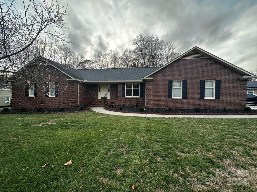 This beautifully updated 4-sided brick ranch in the desirable WoodForest Subdivision combines comfort, style, and modern amenities. Set on a 0.76-acre lot, the home features an oversized master suite with a walk-in closet, plus two additional bedrooms and 2.5 baths. The spacious living room, with built-in shelves and a gas fireplace, is perfect for relaxation and entertainment. Adjacent is a versatile office or dining room. The bright sunroom opens to a large back deck, ideal for outdoor living. The renovated kitchen boasts brand-new stainless steel appliances, including a wine cooler and gas range with an air fryer. A large laundry room and ample storage add practicality. The heated/cooled garage includes a workshop space. Recent updates include keyless entry, ceiling fans, and a 2023 HVAC system. With its functional layout and prime location, this home offers an exceptional living experience. Don’t miss your chance to own this stunning property!