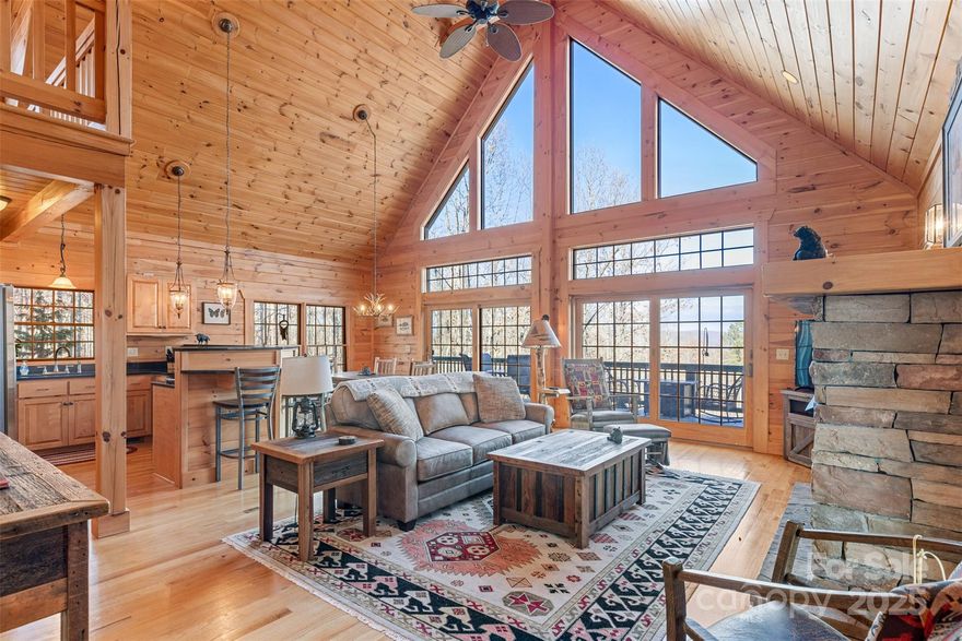 25-mile long range views inspire all who visit this modern three-bedroom Grandview Peaks cabin. Two, main-level bedrooms, vaulted ceilings in the upstairs primary suite and great room, and large lower-level flex-room provide amble space for new mountain endeavors or vacation rental investment. Expansive covered and open decks provide outdoor living while the flat yard and landscaped garden are a rare treat in a home perched on top of a ridge. Character abounds in the gas fireplace in the great room, reading loft overlooking the great room, and built in custom bar in the lower flex room. An outdoor workshop/studio can provide playful respite and inspiration.  Inquire about the option to include furnishings and make this a true turn-key experience.    Grandview Peaks offers exclusive access to a private lake entertaining area, scenic trails, a waterfall, paved roads with gentle grades, and a secure gated entry.