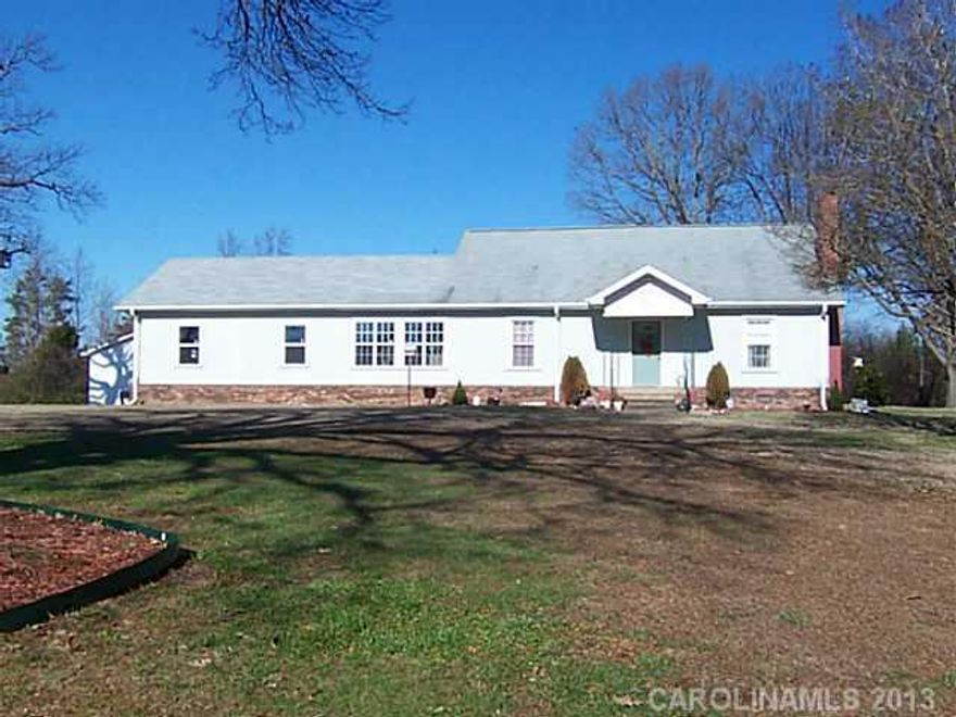 1 1/2 story with large rooms, storage galore, fireplace with gas logs, sunroom, office, jetted tub, workshop, storage buildings, tractor shed, neutral colors.