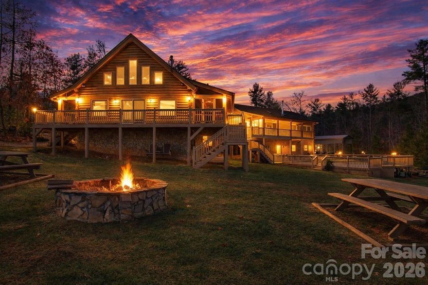 Rare opportunity to own a MULTI-GENERATIONAL estate and income-producing mountain retreat on 10.64 private acres with a year-round spring-fed creek along the northern boundary. Offering 4,008 sq ft of climate-controlled living space across two fully independent cabin wings, plus additional recreation and workshop spaces, this property is ideal for multi-generational living, dual-family occupancy, vacation rental income, Airbnb/VRBO investment, corporate retreat, church retreat, or homestead lifestyle.

The thoughtfully designed layout features two separate residences connected by a climate-controlled breezeway, allowing togetherness with privacy.

West Wing (1,600 sq ft | 4BR/3BA | 2 stories + loft): Vaulted great room with kitchen/dining/family room, wood stove, screened porch, upper and lower decks, loft space, stand-up crawlspace storage, central vacuum, Starlink internet, Roku streaming, and 12 ceiling fans.

East Wing (1,462 sq ft | 3BR/3BA): Vaulted great room, wood stove, library with floor-to-ceiling bookshelves, screened porch and deck. Basement level includes 2-car garage, den, full bath, cabinets, utility sink, and storage. Central vacuum, Starlink internet, Roku streaming, and 12 ceiling fans.

Each wing operates independently with its own septic field, dedicated HVAC, propane tankless hot water system, 22kW Generac backup generator, and 200-amp Duke Energy subpanel—perfect for separate living quarters or rental flexibility. The property also includes 45 solar panels (currently serving the West Wing).

Additional improvements enhance both lifestyle and revenue potential:
• Recreation building with loft and full bath (game room or guest overflow)
• 16’x20’ workshop with loft and full bath
• RV hookups (30 amp and 30/50 amp service)
• 24’ saltwater above-ground pool (Mineral Springs system)
• 7-person hot tub
• 10’x30’ greenhouse with power, water & auto ventilation
• Chicken coop (2023) with fenced run & solar-powered doors
• Raised garden beds, compost bins & bee hives
• Basketball court, stone fire pit & picnic area
• Two wind-rated metal shelters (100+ mph)
• Private 700-ft well (9 gal/min)
• Walking path along creek with abundant wildlife

Located in a gated community with no HOA restrictions (only $350/year road maintenance), this property delivers privacy, sustainability, and exceptional flexibility.

Whether you’re seeking a MULTI-GENERATIONAL compound, a short-term rental investment, a retreat center, or a private mountain homestead with income potential, 2257 Quiet Creek Lane offers a rare combination of independence, recreation, and long-term value.

A truly one-of-a-kind legacy property with endless possibilities.