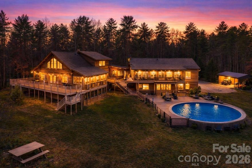 Rare opportunity to own a MULTI-GENERATIONAL estate and income-producing mountain retreat on 10.64 private acres with a year-round spring-fed creek along the northern boundary. Offering 4,008 sq ft of climate-controlled living space across two fully independent cabin wings, plus additional recreation and workshop spaces, this property is ideal for multi-generational living, dual-family occupancy, vacation rental income, Airbnb/VRBO investment, corporate retreat, church retreat, or homestead lifestyle.

The thoughtfully designed layout features two separate residences connected by a climate-controlled breezeway, allowing togetherness with privacy.

West Wing (1,600 sq ft | 4BR/3BA | 2 stories + loft): Vaulted great room with kitchen/dining/family room, wood stove, screened porch, upper and lower decks, loft space, stand-up crawlspace storage, central vacuum, Starlink internet, Roku streaming, and 12 ceiling fans.

East Wing (1,462 sq ft | 3BR/3BA): Vaulted great room, wood stove, library with floor-to-ceiling bookshelves, screened porch and deck. Basement level includes 2-car garage, den, full bath, cabinets, utility sink, and storage. Central vacuum, Starlink internet, Roku streaming, and 12 ceiling fans.

Each wing operates independently with its own septic field, dedicated HVAC, propane tankless hot water system, 22kW Generac backup generator, and 200-amp Duke Energy subpanel—perfect for separate living quarters or rental flexibility. The property also includes 45 solar panels (currently serving the West Wing).

Additional improvements enhance both lifestyle and revenue potential:
• Recreation building with loft and full bath (game room or guest overflow)
• 16’x20’ workshop with loft and full bath
• RV hookups (30 amp and 30/50 amp service)
• 24’ saltwater above-ground pool (Mineral Springs system)
• 7-person hot tub
• 10’x30’ greenhouse with power, water & auto ventilation
• Chicken coop (2023) with fenced run & solar-powered doors
• Raised garden beds, compost bins & bee hives
• Basketball court, stone fire pit & picnic area
• Two wind-rated metal shelters (100+ mph)
• Private 700-ft well (9 gal/min)
• Walking path along creek with abundant wildlife

Located in a gated community with no HOA restrictions (only $350/year road maintenance), this property delivers privacy, sustainability, and exceptional flexibility.

Whether you’re seeking a MULTI-GENERATIONAL compound, a short-term rental investment, a retreat center, or a private mountain homestead with income potential, 2257 Quiet Creek Lane offers a rare combination of independence, recreation, and long-term value.

A truly one-of-a-kind legacy property with endless possibilities.