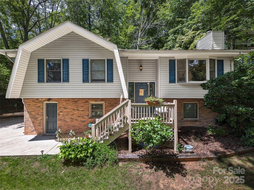 Surrounded by charming barns and rolling pastures in the desirable Dogwood Acres community of Clyde, this beautifully renovated home offers the perfect blend of comfort and convenience. Brand new heat pump 2025. Updated just a few years ago, the home features modern upgrades, appliances, solid surface countertops, stylish vanities, and warm wood floors . The open floor plan creates a welcoming space, ideal for both everyday living and entertaining. The main level offers 2 bedrooms and 2 bathrooms, while the lower level provides a spacious family room, office space, laundry area, and garage. Step outside to enjoy the peaceful setting with electrical already installed in the backyard, ready for a hot tub addition. Perfectly situated between Waynesville and Asheville with quick access to I-40, this home offers an excellent central location while maintaining a serene country feel.