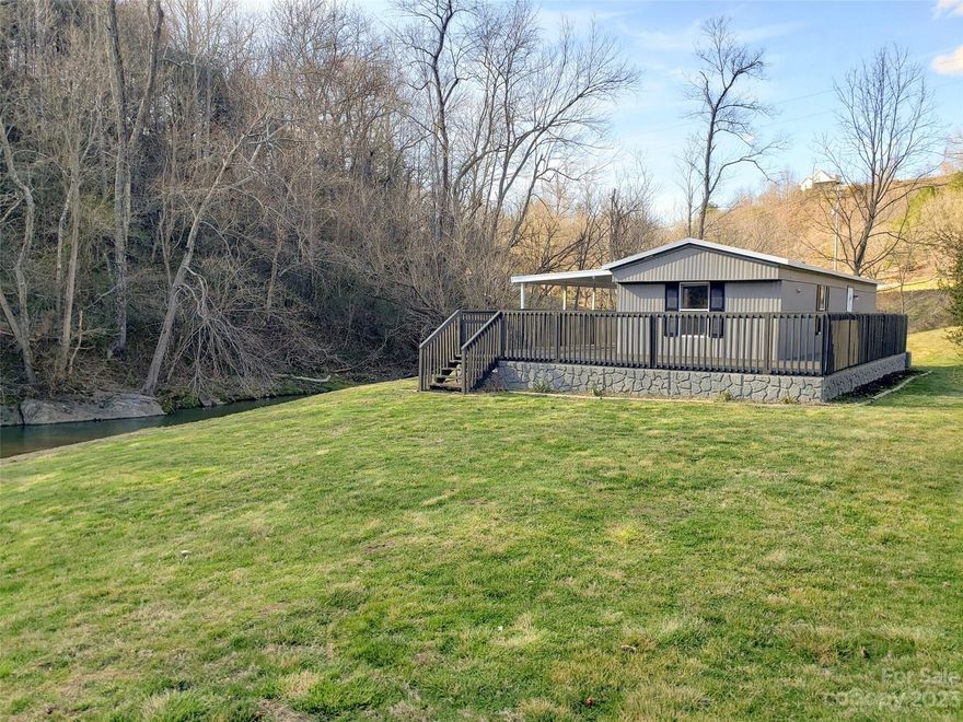 Creek living is the life! Enjoy the deck and level yard while entertaining and listening to
the creek. This cozy 2BR/1BA home in the Crabtree community is a gem. Recent updates include kitchen, bathroom, living area, as well as fresh paint inside and out. This home would make a great primary home, secondary mountain home or rental. Well pump  replaced 2 years ago. The home is not in a flood zone , though it is on the creek, according to Haywood County GIS. Very convenient to Lake Junaluska, Canton, Waynesville, and
Maggie Valley all are 15-20 minutes and 10-13 miles depending on your destination, and only 30
minutes to Asheville. Plenty of restaurants, shopping, and sweet mountain living here.
