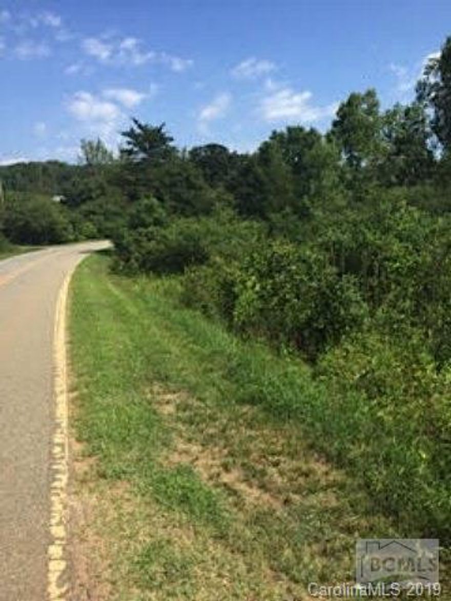 The lot gently slopes making it a perfect mobile home site or for a single family with a basement!  Subject property backs up to a community pond.