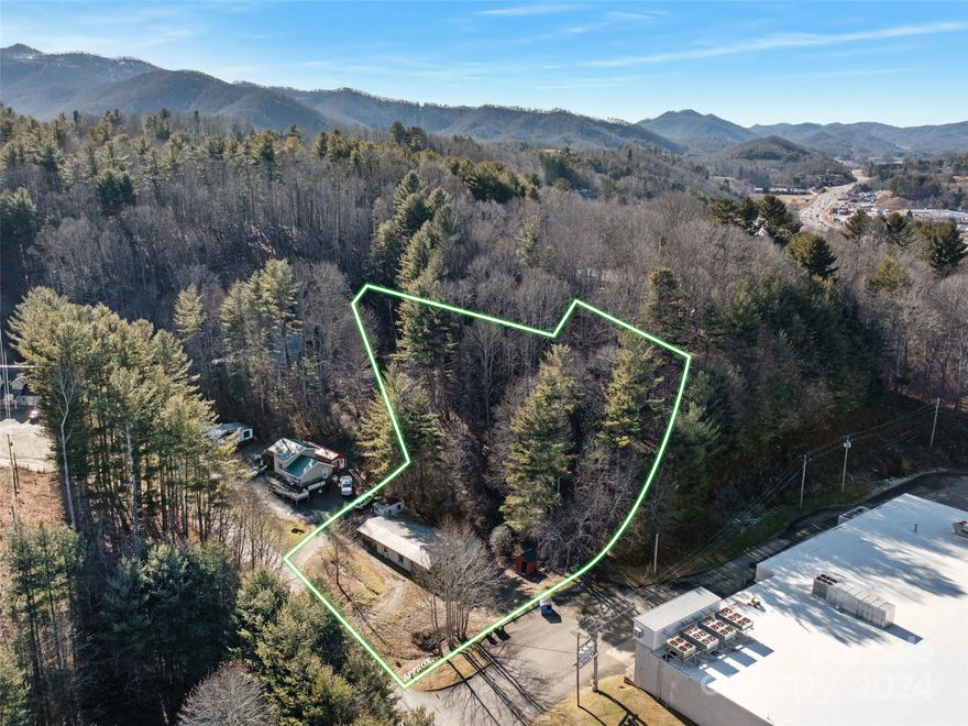 Property on front end of Bowditch Street in the township of Burnsville with Town Water & Town Sewer
and a power pole (could be reactivated). This land has partially wooded 1.549 acre Lot which has a
recent survey as a portion of a larger Property PIN & host a Duplex holding some value but not
currently livable in present state and is being sold "AS -IS/WHERE-IS."The duplex has a total of 6
BR ,Unit 330 and Unit 332 & 2 bath & each has open Kitchen & Living room areas.Floor plan available
& outlines the total of 2037sq ft dwelling on lot that would make a good improvement project and
could be income producing again with some work. Build additional homes with Mtn & City views