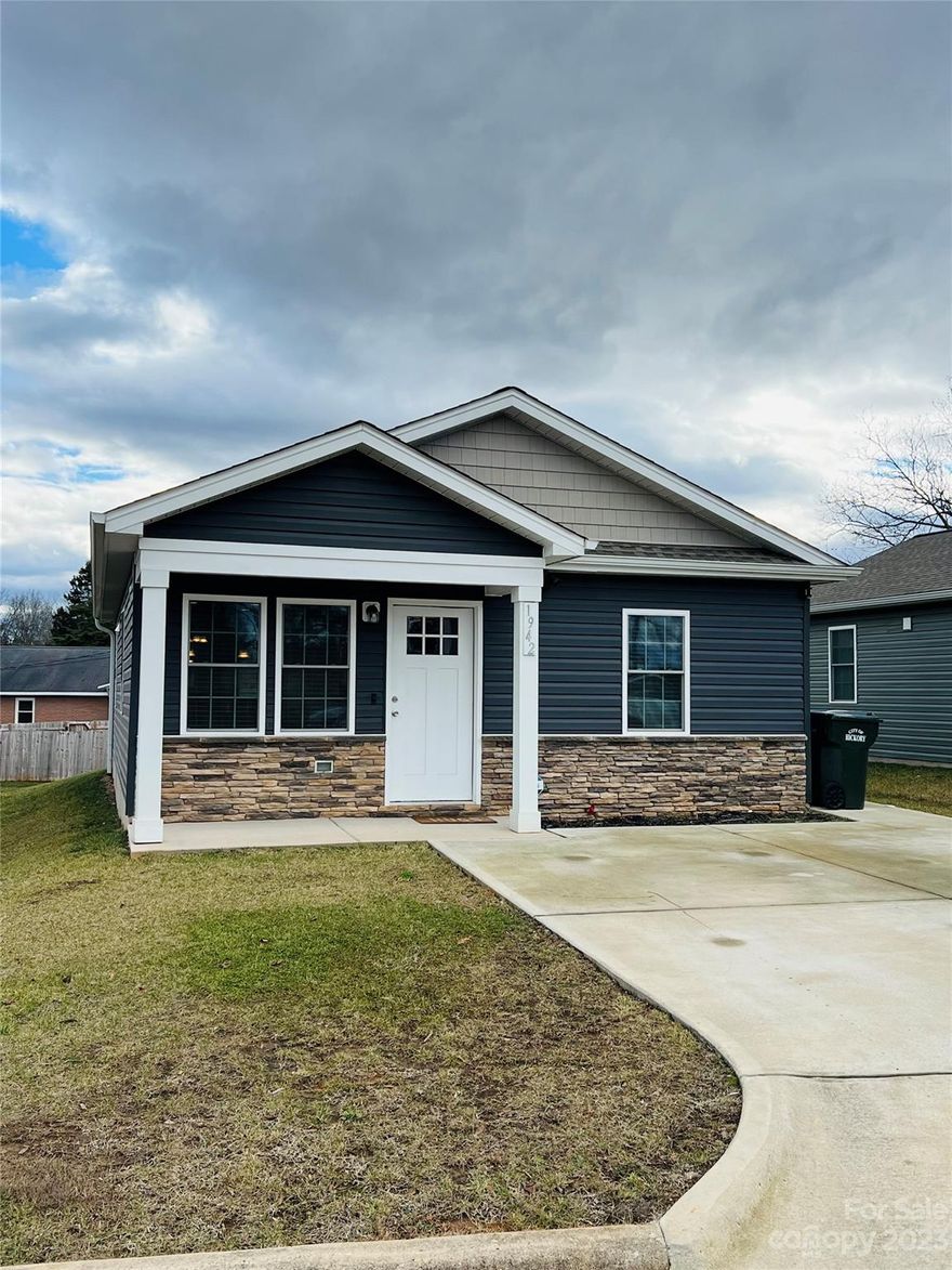 Adorable almost new bungalow within minutes of downtown Hickory. This house is just 3 years old, with vinyl/stone siding and a small yard, so you can enjoy life more and spend less time worrying about home maintenance. Check out the open floor plan of this ground level home and it's spacious kitchen with granite countertops. There is an eat at breakfast bar with a dining area to rear of kitchen. Step outside the backdoor to a patio that has room for a grill to entertain family/friends. There is carpet in both amply sized bedrooms which share a bathroom with double vanity and granite countertop. Conveniently located to shopping, restaurants, and schools.