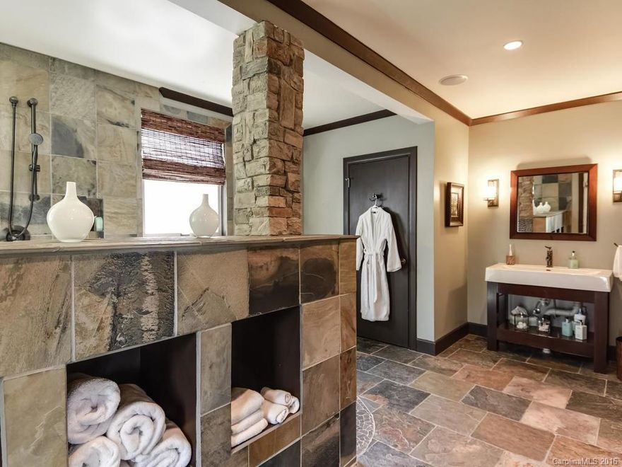 3 level dream WF home w/Elevator, fully reno'd for resort style living! Point lot, 500’ shore, natural sand beach, Heated saltwater pool/waterfall, Gazebo & 4 slip/2 lift dock! Zen-feel 5 Spa Baths. Masters on 2 lvls w/custom WICs & sitting areas (1 w/See-thru FP). Guest-ready 1st flr GR w/Murphy Bed & Wet bar. Studio/Workout-sep entry w/Bath & Pool access. High-end appls, honed granite. Office. 2nd GR w/FP. Sep 1 BR Luxury Apt. Circle drive. Open/fenced garden areas w/stone paths & Firepit.