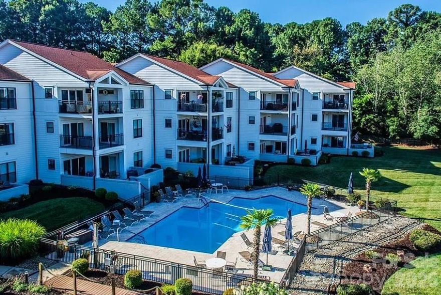 Perched on the third floor in the highly desirable Half Moon Bay community, this inviting condo offers beautiful views of Lake Norman and a relaxed, low-maintenance lifestyle in the heart of Cornelius. Enjoy peaceful mornings and stunning sunsets from your private vantage point overlooking the water.

Inside, the open-concept layout is filled with natural light, creating a bright and airy feel throughout the main living space. The living room flows seamlessly into the dining area and kitchen, making it ideal for both everyday living and entertaining. Large windows and sliding glass doors showcase the lake views and bring the outdoors in.

The spacious primary suite provides a comfortable retreat, while an additional bedroom offers flexibility for guests, a home office, or hobbies. Thoughtful design and easy flow make the home both functional and welcoming.

Located just minutes from shopping, dining, and marina access, this condo combines convenience with scenic charm. Whether you're looking for a full-time residence, weekend getaway, or investment opportunity, this Lake Norman-view property delivers the best of lakeside living.