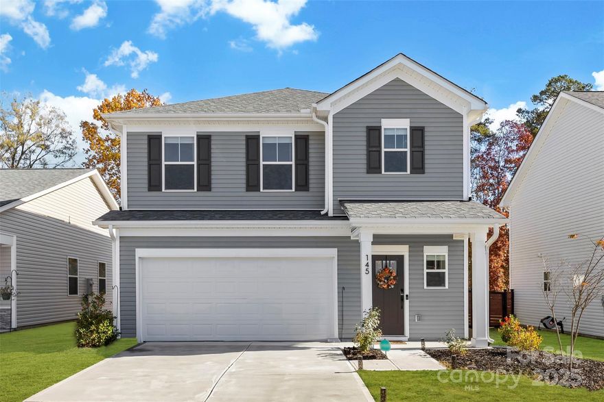 Welcome home to this beautifully maintained 3-bedroom, 2.5-bath residence tucked inside the Surrey Woods community. The main floor welcomes you with an open layout where the living room flows seamlessly into the dining area and kitchen, creating an inviting space for hosting, relaxing, or enjoying your favorite shows. The kitchen stands out with its white soft-close shaker cabinets, quartz countertops, and a stunning tile backsplash that pairs perfectly with the stainless steel appliances. The entire home features luxury vinyl plank flooring no carpet anywhere along with upgraded trim details, a stylish pedestal sink, enhanced fixtures, and thoughtful selections throughout. Upstairs, you’ll find all three bedrooms along with a dedicated laundry room (not a hallway laundry!), complete with built-in cabinetry and a recessed dryer vent for added convenience. Both full bathrooms offer quartz countertops atop soft-close white shaker vanities, continuing the clean and cohesive design. This home blends modern finishes with practical everyday living, creating a comfortable and well-appointed space ready to enjoy.