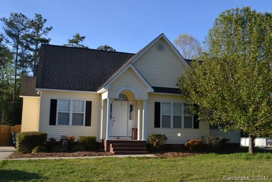 Cute as can be with awesome curb appeal. Wood laminate flooring in great room and kitchen.  Large master and master bath has dual vanities.  Two additional bedrooms and a hall bath.  Pets will love the big, fenced back yard and deck.  Will not last long.