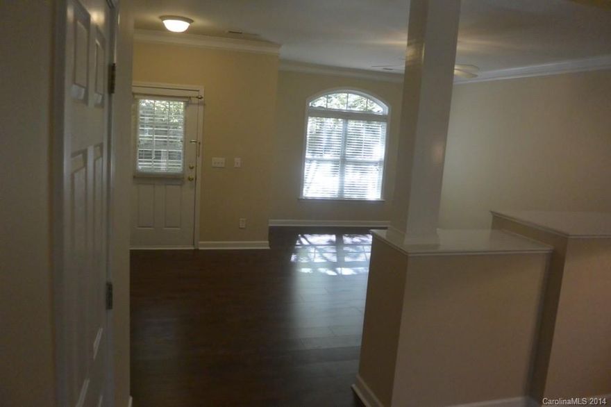 Terrific home awaits you! 3 Bedroom 2 1/2 Bath in the desirable Ballantyne location. Walking distance to the new Publix.  Renovated Gorgeous Master bathroom. Open Floor Plan with Brand New Laminate floors on the main level! Plenty of room to enjoy the enclosed patio with a large storage room. Front covered porch faces landscaped courtyard. Conveniently located to I-485, Ballantyne Corporate Park, shopping and dining.