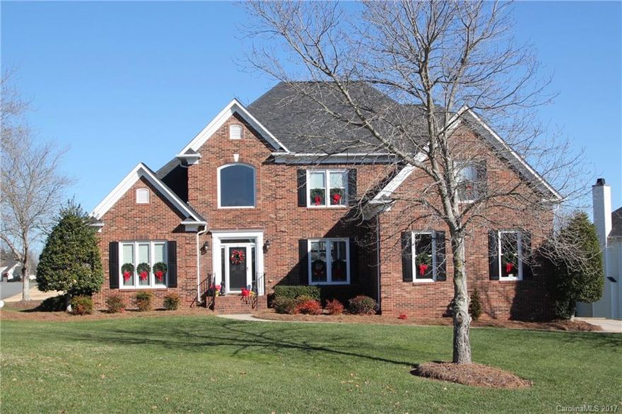 Beautiful full brick home on the golf course in popular golf community.  Kitchen is spacious with large island, updated appliances, granite counters and gas cooktop.  Master on the main level with updated master bath with soaking tub and steam shower.  Living/room office on main level.  Upstairs has 3 bedrooms plus awesome media room with media seating.  Backyard has privacy and hottub and fire pit.