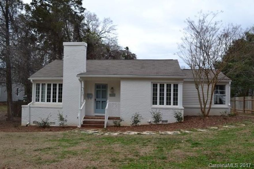 What a dollhouse! This one will not last long! Mostly brick ranch in desirable neighborhood.  Beautiful hardwood and tile flooring throughout. Living room & dining room, granite kitchen with stainless appliances.  Cozy master has fireplace/gas logs and a gorgeous master bath! Tons of windows to bring in the natural light.  Huge deck is great for entertaining, patio area has a grill and sink. Yard is partially fenced-only need a small part on right front to make complete. Move in ready!