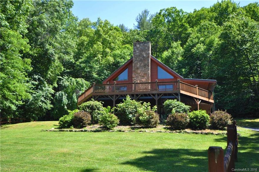 Beautiful Log Home bordering National Forest. Walking distance to downtown Hot Springs, convenient to shops, restaurants, fishing, whitewater boating, & the Appalachian Trail. Spacious great room with stone fireplace, open to kitchen 3BR/3BA. Wrap around porches and decks. Lower level with family room, full bath & outside entrance. Sunny & gentle land.