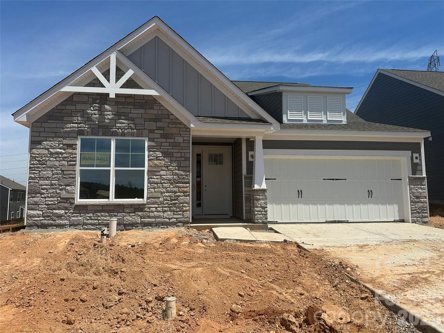 Brand new construction in an amenity-rich community less than two miles from Lake Norman! This 1.5-story Wescott plan has 3 bedrooms, 3 full baths, and more than 2,600 square feet of living space. The kitchen features white cabinets with a contrasting grey island, quartz counters, tile backsplash, a stainless range hood, and stainless appliances, including a gas cooktop. Matching base cabinets, counters, and backsplash extend into the breakfast area to create a buffet, which is perfect for entertaining. The primary suite is on the main has a tray ceiling in the bedroom and a luxury shower in the bathroom. The main floor also includes a formal dining room with tray ceiling, an office with French doors, family room with Cosmo fireplace, a secondary bedroom, a full bath with a 4-ft shower, laundry room, and a mud room with a built-in, beadboard drop zone. The upper floor has a loft, bedroom, and full bath with a tub/shower combo. Community amenities include a pool, cabana, pickleball courts, and pocket parks. Find out more today!