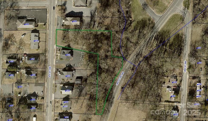 Own a piece of unimproved commercial property in downtown.  This property is 1.07 acres and has access to 2 publicly maintained streets.  Surrounded by other businesses and on a busy road.  Build whatever your business needs in this downtown location.  Sign on property to locate easily.
