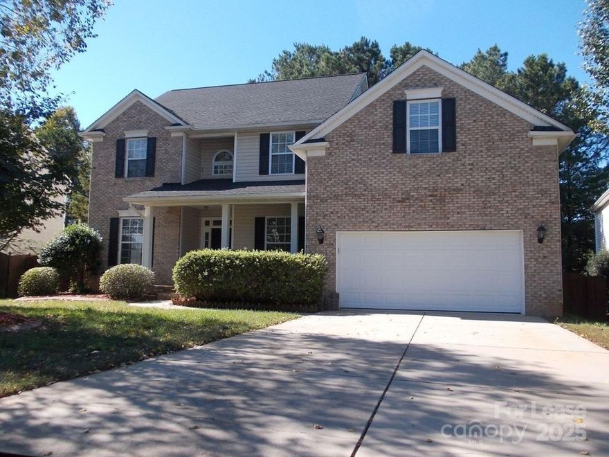 This larger beautiful home features 6 bedrooms, 3 full bathrooms and over 3100 square feet. It has a formal dining room, sitting room, spacious living room with fireplace and great size kitchen with black appliances and breakfast area. Lower level bedroom and full bath. Master upstairs has private full bath with dual vanity, separate tub/shower and oversized walk in closet. 4 good size secondary bedrooms and 3rd full bath also upstairs. Large deck, fenced yard and 2 car garage. This home has everything! All appliances included. Located just off Lancaster Hwy near Ballantyne Commons Pkwy. Close to both Pineville and Ballantyne. Easy access to I-485. Rent this home with $3100 deposit and first month's rent.