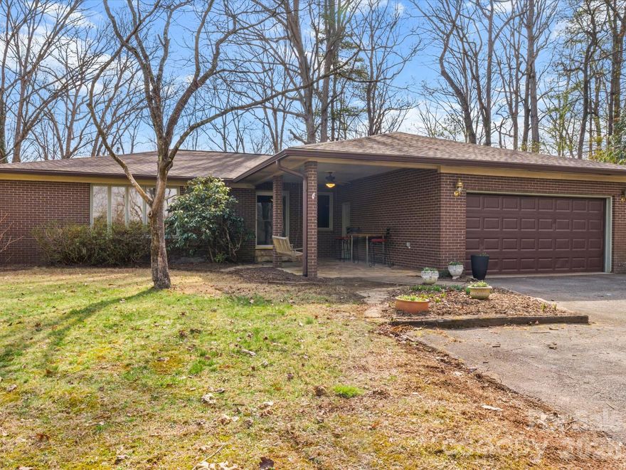 This stunning brick ranch home in Cullowhee delivers the lifestyle you've been searching for! The location doesn't get better than this - walkable and bikeable to Western Carolina University, and just a short drive from the charming shops and restaurants of Sylva, Dillsboro, Cashiers, and beyond. The home sits on a quiet, dead-end street lined with beautiful evergreen rhododendrons, making you feel worlds away in just minutes. Much of the 1.46 acre land is bordered by the Cullowhee River Club, a community focused on outdoor living and activities. Panoramic mountain views greet you from nearly every oversized window, while the newer Trex deck and outdoor firepit make the backyard your personal retreat. Inside, over 2600 square feet of living space offers mountain serenity with room to spread out. Three spacious bedrooms plus a primary bedroom that features a walk-in closet, built-ins, and an ensuite bathroom ensure space for everybody. Both full bathrooms have been recently renovated, and the oversized sunroom is a true showstopper - sunrises with morning coffee or an afternoon curled up with a book with your plants. A dedicated den with a cozy gas-fireplace provides an ideal home office setup for remote workers or creatives who need their own space. The basement provides extra storage space or room for a workshop. This home has the space, mountain setting, and central Cullowhee location to fit your life perfectly. Schedule your showing today!