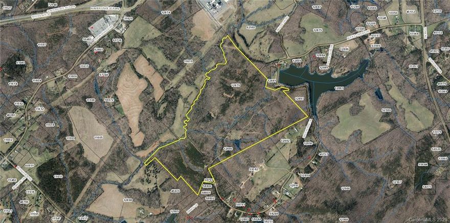 Approximately 184.65 acres of land located less than one mile from the proposed casino.  Conveniently located with easy access to I85 this property is less than 30 minutes from Charlotte Douglas International Airport.  210 ft of road frontage by the old City Lake which could be an additional access point to the property.  Rolling hills provide great dirt to accommodate many uses.  The beautiful mountain views and peaceful streaming creeks, make this a truly unique property.  Currently zoned Residential.  All 3 parcels must be sold together.