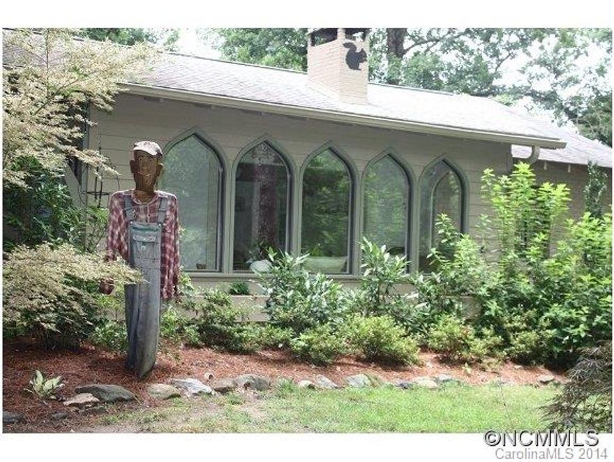 Adorable hunt box located in Tryon's desirable Hunting Country. Privately set on 2 acres surrounded by beautiful large hardwood trees. Tastefully updated and very charming with cottage style kitchen, living/dining room w/wood burning fireplace, bright sunroom w/gothic style windows, hardwood floors, large utility/mudroom, patio, detached 2 car garage/workshop.