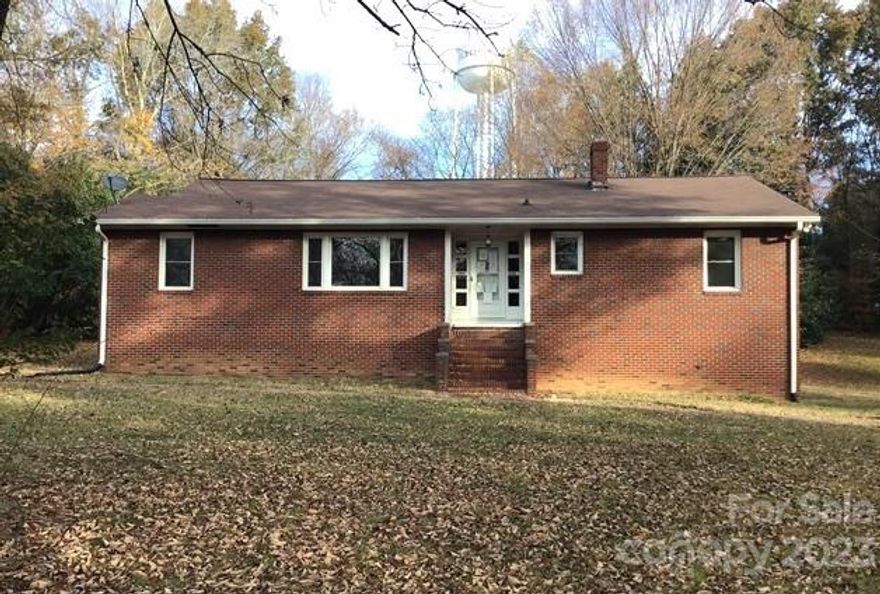 Look no further, this stunning full brick ranch with an unfinished basement is over 1 acre of land and has loads of potential! Home features glassed in back porch, formal dining room, fp in living room, and a den. The basement houses the garage, a half bath, and a laundry. Home has wood floors in most of the rooms! Come and add your personal touch and make this home yours!