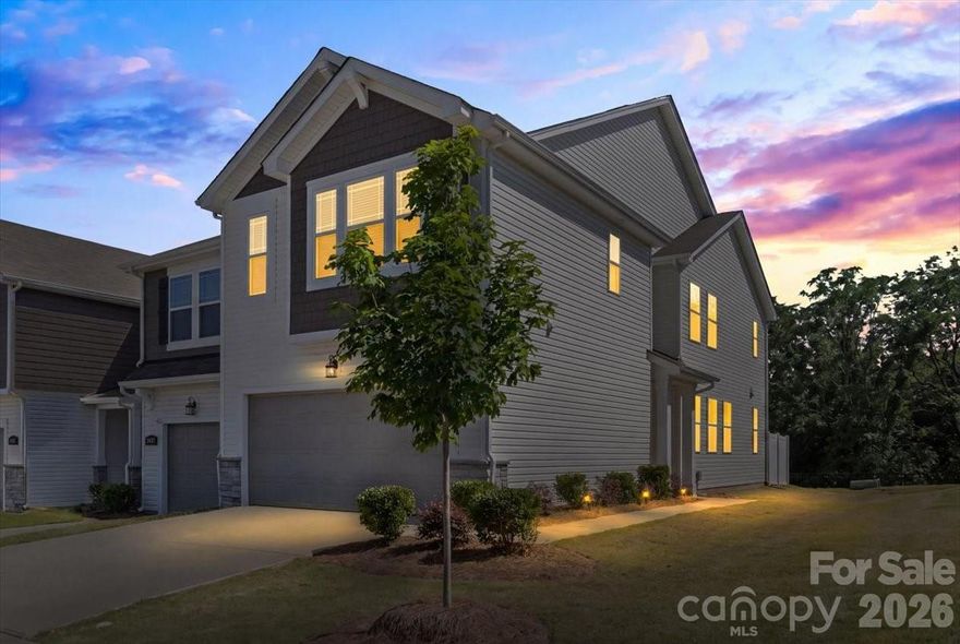 Welcome to 4529 Iron Oak Lane — a beautifully maintained end-unit townhome offering modern style, low-maintenance living, and a spacious open-concept design in one of Charlotte’s growing communities. This like-new home features a bright and airy main level with luxury vinyl plank flooring, abundant natural light, and a stunning kitchen complete with quartz countertops, stainless steel appliances, subway tile backsplash, gray cabinetry, and a large center island perfect for entertaining. The inviting living area centers around a cozy fireplace and flows seamlessly to the private patio and side yard. Upstairs, the spacious primary suite offers a tray ceiling, oversized walk-in closet, and spa-inspired bath with dual vanities and a tiled walk-in shower. Additional bedrooms provide flexibility for guests, office space, or hobbies. Situated on a premium corner lot with extra green space, this home combines comfort, style, and convenience with easy access to shopping, dining, major highways, and everything Charlotte has to offer.