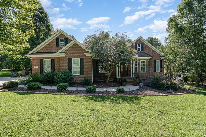 Stunning full brick ranch with sideload garage on an acre lot in quiet Greenbriar Farms neighborhood. Walk in to the two story foyer where you will be greeted by the intimate dining room on the left and office area with closet on the right. Large kitchen with granite countertops, island, custom cabinets and breakfast area are open to the oversized great room that features a gas log fireplace, built in shelves and gorgeous windows to enjoy the views of the screened porch, Trex deck and private backyard. Recently replaced carpeting in bedrooms and, fresh paint on lower level Upper level has tons of square feet, including a bonus room, flex space, second washer/dryer hookup and possibility for an additional bedroom. This level also has a full bathroom and a bunch of storage. Relax on the screened in porch, entertaining on the deck or exploring the peaceful yard. Additional features include central vac, home wired for surround sound and water softener. Close to I-77.