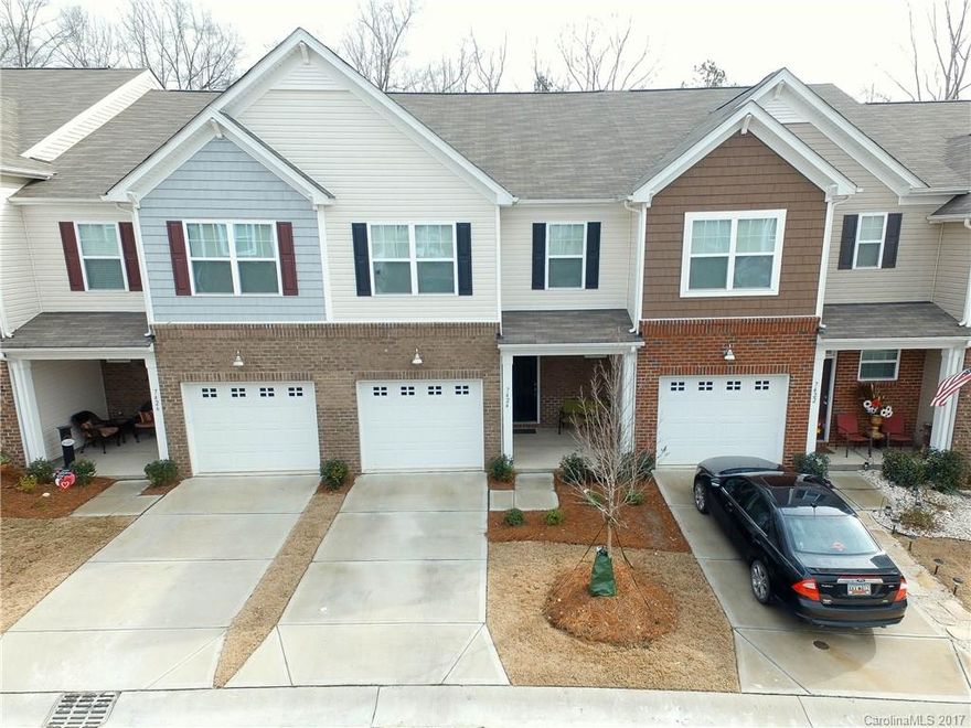 Come see this beautiful 3 bed/2.5 bath town home in The Woodlands subdivision.  Open floor-plan - kitchen has stainless appliances, granite counter tops, bar and tile back splash. Gas fireplace in living room. Wood floors throughout downstairs.  Covered patio in the back.  Large master bedroom has trayed ceiling and large walk-in closet.  The master bath has tiled shower and garden tub.  Large 2nd floor laundry room.  Neighborhood has a pool and elementary school. Includes attached 1 car garage.