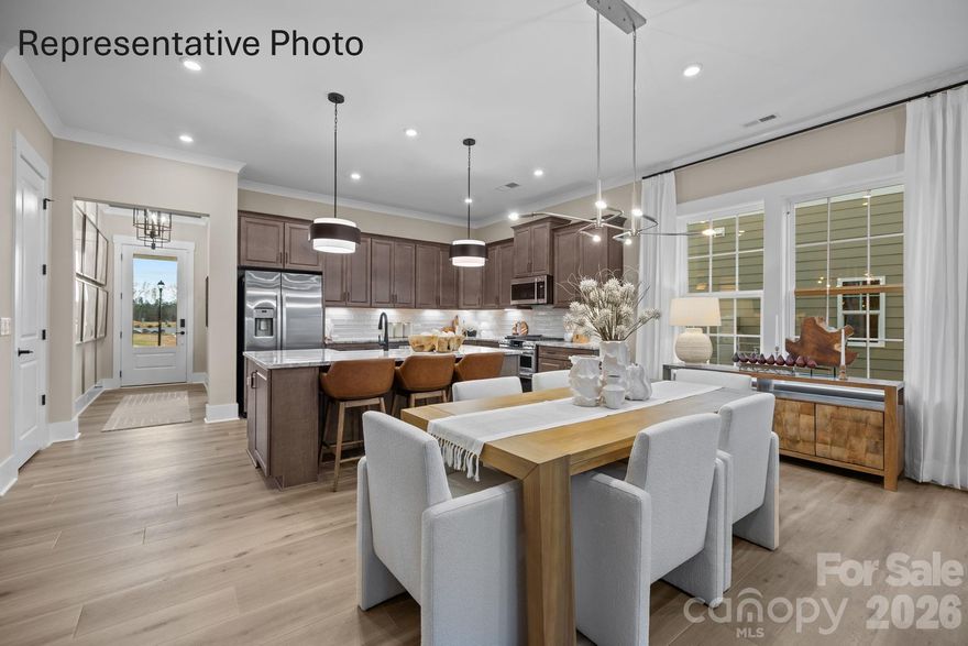 Welcome to The Virtuoso, a home where creativity and craftsmanship come together in perfect harmony. Thoughtfully designed to maximize space while showcasing your unique style, this floor plan offers a seamless blend of elegance and flexibility. From the moment you enter, the open-concept kitchen and café dining area flow effortlessly into the gathering room. Creating an inviting setting for both everyday living and memorable entertaining. This beautiful home has 10 ft ceilings with 8 ft doors, 42 inch cabinets in kitchen, and LVP in foyer, kitchen, flex room, gathering room and cafe.