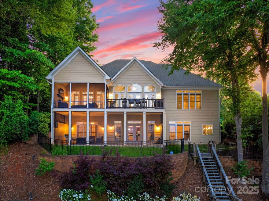 Stunning Lake Norman retreat tucked away in the gated community of Astoria where luxury and privacy meet. Experience breathtaking sunrise views from this beautifully updated home. The light filled interior is spacious and offers designer finishes with main level living and an open floor plan, elegant owner's suite with peaceful main channel views. Entertaining is a treat with main level and lake level verandas, perfect for hosting guests or relaxing and enjoying refined lake living with your own private pier, covered deep water boat slip. Lake level full kitchen & secondary living quarters w/ exceptional storage space to keep you organized.  A spacious unfinished room offers endless possibilities. Enjoy Lake Norman State Park across the lake providing natural, untouched beauty. Astoria is a private gated community with 40 acres of natural woodlands, walking trails, a community garden and community pier with golf cart path for easy access. Live where everyday life feels like a getaway!