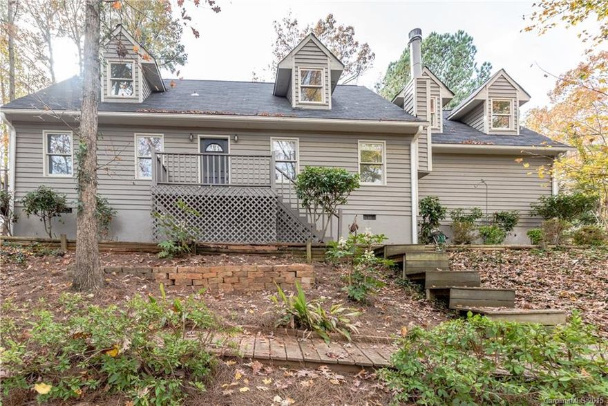 Established wooded lot! Hardwood floors t/o the main floor. Master on the main floor w/ dual closets, a private deck, and master bath. Great room w/ floor to ceiling stone fireplace, sold "as-is" with no known issues. Kitchen features granite counters. Fresh paint t/o this home inside & out! New frieze carpet upstairs.  Two spacious guest bedrooms share a hall bath. Large loft for rec space or office. New windows upstairs. New HVAC 2014, roof 2011, new landscaping & retaining wall in back yard.