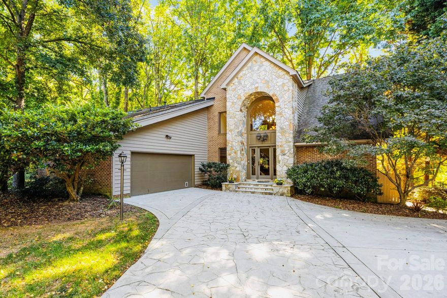 Experience the pinnacle of Lake Norman WATERFRONT living in this exceptional, private retreat—perfectly positioned between Jetton Park and Ramsey Creek Park—with the rare advantage of no HOA. Set on a beautifully wooded .73-acre cul-de-sac lot, this property gently slopes to an expansive, freshly dredged cove (completed at the seller’s expense of $93,000), offering enhanced water depth, usability, and long-term value.Designed to capture breathtaking water views from nearly every angle, the home features an inviting open-concept kitchen and sunlit breakfast area framed by walls of windows. The dramatic two-story great room showcases soaring ceilings, abundant natural light, and a striking fireplace—creating an elegant yet welcoming centerpiece ideal for both everyday living and entertaining. The main-level primary suite offers a private sanctuary with a walk-in closet, soaking tub, and separate shower. Also on the main level: a dedicated office, guest bedroom, full bath, and a thoughtfully placed laundry room for convenience. Upstairs, three additional bedrooms, two full baths, and a versatile flex space provide endless options for a gym, media room, or creative studio. Outdoor living is equally impressive. A serene screened porch overlooks a lush, private backyard that leads to an extended shoreline featuring a private dock and covered gazebo—perfect for lakeside entertaining, sunset views, or peaceful mornings on the water. Situated in a calm no-wake cove with quick access to the main channel, this location offers the best of both tranquility and convenience. Just minutes from The Peninsula Club, Lake Norman Yacht Club, I-77, upscale dining, shopping, and medical facilities, this home represents a rare opportunity to own a premier waterfront estate in one of Cornelius’s most sought-after locations. A truly exceptional offering—where privacy, luxury, and lifestyle converge on Lake Norman.