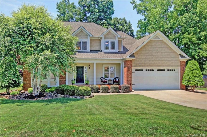 Custom-built home w/YEAR ROUND WATERVIEW & upgrades galore! Hardwoods throughout main. Kitchen w/cherry cabinets, Travertine backsplash, under/over cabinet lighting & island w/electric cooktop (gas plumbed). Custom blinds, surround sound & central vac. Large master suite w/double trey ceiling; bath w/corner garden tub/tile surround, dual vanities, tile floors, walk-in shower & custom, walk-in closet. Level, fenced yard w/gorgeous outside patio & fire pit. Additional parking pad & shed. Hurry!