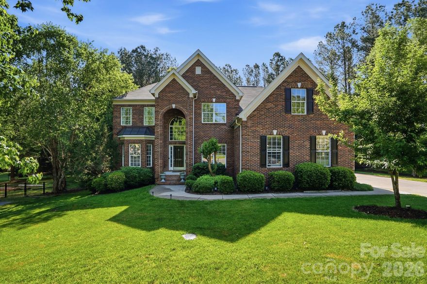 Stately brick home in sought-after Quellin, perfectly positioned on a quiet cul-de-sac in the heart of Waxhaw. This spacious 5-bedroom, 3.5-bath transitional home offers 3,742 sq ft of thoughtfully designed living space with a highly functional layout ideal for both everyday living and entertaining.

Step inside to find a welcoming two-story foyer, formal dining room, and flexible living space perfect for a home office. The great room features a cozy gas fireplace and flows seamlessly into the kitchen, complete with white cabinetry, stainless steel appliances, double ovens, gas cooktop, and breakfast area.

Main floor expansive primary suite offers a relaxing retreat with a garden tub, separate shower, and dual vanities and walk-in closet. Additional bedrooms are generously sized, and a large bonus room provides endless possibilities for a media room, playroom, or guest space.

Enjoy outdoor living on the deck and patio overlooking a private, fenced backyard. Additional highlights include a 3-car side-load garage, insulated windows, and mature landscaping.
Located in a highly desirable community with amenities including a clubhouse, pool, playground, pond, and walking trails, pickleball and basketball courts.—plus top-rated Cuthbertson schools.

Classic curb appeal, generous space, and a prime location—this is Waxhaw living at its finest.