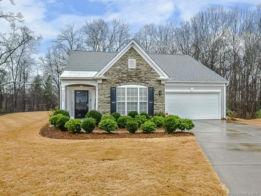 Beautiful & Bright,open floor plan w/split 2 bedroom,2 bathroom home with many wonderful upgrades!RECENT UPGRADES INCLUDE:New front storm door,New laminate wood floor throughout (except all baths have new ceramic tile),30 yr architectural shingles replaced in 2011,ceramic tile floor on outdoor patio,windows added to garage,extra insulation added to attic creating optimal energy efficiency.Home is situated on a large cup-de-sac lot with huge yard backing up to woods.Visit today!