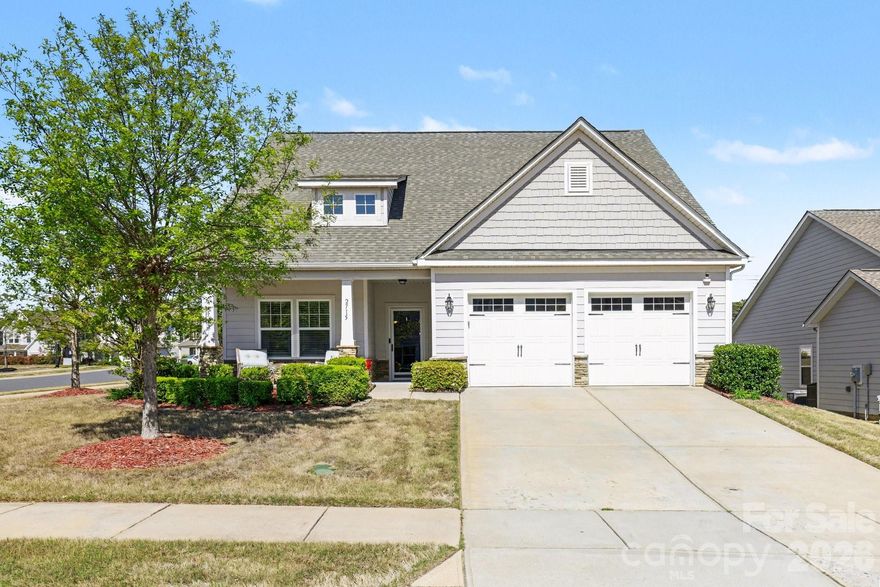 Popular floorplan in The Manors at Handsmill, a gated Lake Wylie community! This 4-bedroom home features a primary suite on the main level with an additional bedroom upstairs, offering flexible living space. Situated on a desirable corner lot, enjoy relaxing on the covered front porch or the screened-in rear porch. Handicap accessible with stair lift (can be removed). Amenities include clubhouse, fitness center, pool, playground, trails, and private lake access. Come check it out today!