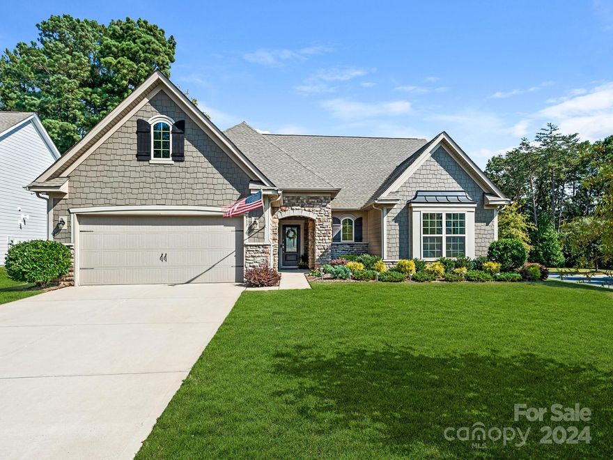 Discover Remarkable Pride of Ownership in this 2019 MOVE-IN READY RANCH, located on a Corner Lot with Tree-Lined/Fenced Backyard and Extended Paver Patio. Luxury Features include LVP Flooring, Custom Plantation Shutters, Upgraded Lighting and Neutral Interior Paint Colors (2021). Welcoming, Open-Design Leads to Sun-filled Living Room and Bright Kitchen featuring Oversized Quartz Island/Countertops, Coordinating Tile Backsplash, Double Oven, Stainless Steel Appliances and 2 Pantries. Thoughtfully-Designed Floorplan Offers Private Owner’s Suite with Spacious Walk-In Closet and Separate Wing for Secondary Bedrooms/Bath. Fantastic Storage/Extra Closets. Full Lawn Irrigation System (Timed, Zoned and Highly-Customizable). Located in an Amenity-Rich Community with Pool, Clubhouse and Year-round Events. Enjoy LOW South Carolina Taxes (for Primary Residents), Just Minutes from Popular Shopping and Dining! Ask your Agent for Additional MLS Attachments (Upgrades/Feature Sheet, Survey, CCRs, etc.)