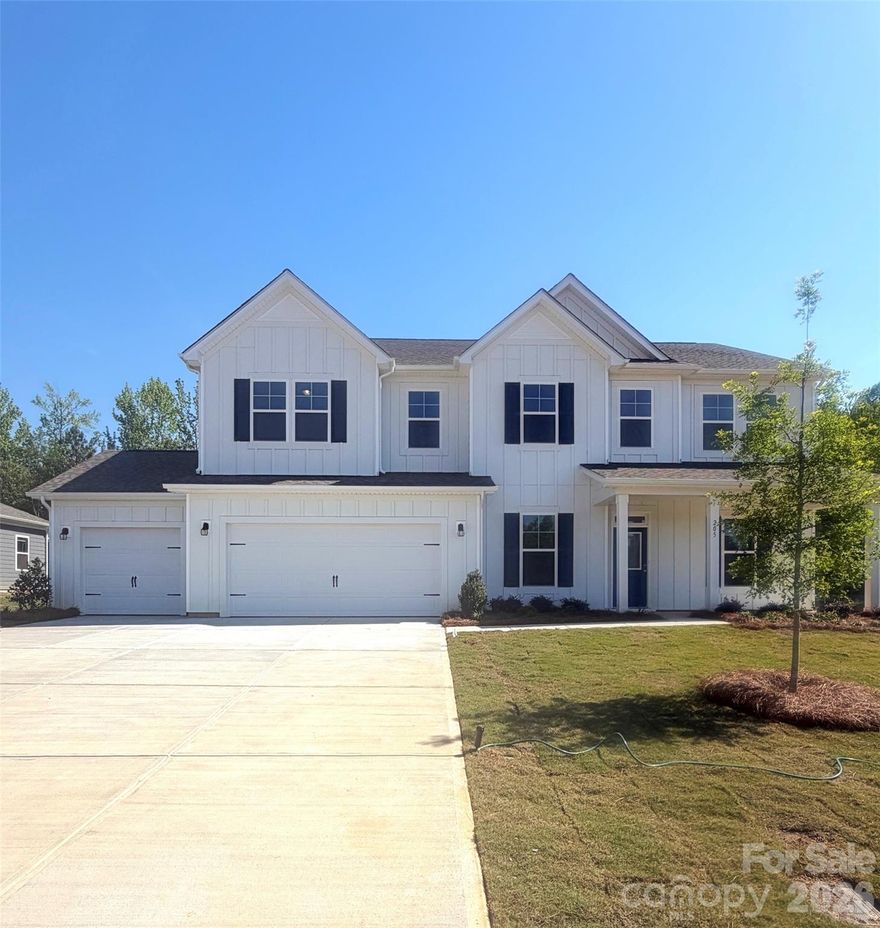 Welcome to The Dickinson located in the new community of Amber Glen in Locust! From the exterior, you'll notice the garage has been extended to include a carriage garage, perfect for an extra workspace or for guests to have a secure place to park. Walking in from the front covered porch you are greeted with a warm and inviting 2-story foyer. Just off the foyer is a private study with glass paned French doors and a formal dining room. The home will open up into your family room, kitchen and breakfast area. The spacious family room has an electric linear fireplace that is color changing to fit any mood or occasion. The kitchen is fit for a chef, featuring stainless steel appliances, a gas cooktop with an overhead exhaust hood, wall oven and kitchen island. You'll notice throughout the main areas  of this level has been finished with easily maintainable EVP flooring to make cleaning a breeze. Through the atrium door you'll find an extended covered porch, perfect for entertaining or enjoying a morning coffee. Finishing this level is a main level guest suite with its own private bathroom to allow plenty of privacy for guests. Upstairs you'll be greeted with a spacious loft for an extra area to entertain. There are three additional bedrooms, all with walk-in closets and one with its own private bathroom. The shared secondary bedroom is conveniently located for easy access and has a dual vanity and seperated toilet and showering area to allow everyone privacy and comfort. The laundry room has been completed with overhead cabinets that elevates the space and provides maximum storage and organization. Walking into the Owner's suite you will instantly feel like royalty. Featuring a tray ceiling, LED lighting and plenty of space for furniture, you may find it difficult to get up in the mornings. The large walk-in closet is sure to accomodate any size wardrobe. Finally, the en-suite will feel like walking into a spa, with a dual vanity, tiled shower and private toilet area, everyone will have plenty of space and privacy to get ready in the mornings. Welcome to your new home!
