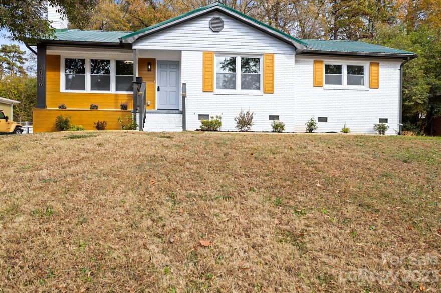 Welcome to this beautifully updated 3 bedroom, 2 bathroom ranch-style home within minutes of Uptown Charlotte, yet offering the peace and tranquility of a well-established neighborhood. The inviting entry leads to an open plan, featuring an electric unit fireplace as a focal point. New kitchen appliances & cabinets, HVAC and windows, carefully-selected LVP floors coordinate with the refinished wood floors throughout the living areas. Additional updates include fresh paint, modern lighting and plumbing fixtures, new stainless steel kitchen appliances, and gleaming quartz countertops. The modern-style waterfall kitchen breakfast bar offers an openness leading to the pantry, laundry and fenced back yard. Bathrooms boast new tile floors, vanities, and showers, and fixtures. Leading out the back door, you will find extra storage space, separate laundry area with a new water heater. This updated home provides the perfect space to enjoy your private retreat, minutes from restaurants, NO HOA!