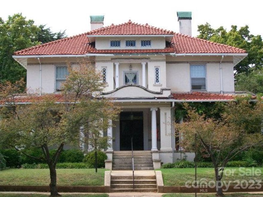 Frank Kirk House from 1913. High ceilings, moldings, wainscoting, pocket doors, beautiful parquet flooring w/inlay, grand staircase, built-ins, elevator, screened porch, walk-up floored attic, full basement, tiled porches, fireplaces with beautiful mantels and 4 balconies. Exceptionally good closet & storage space for the era built.  Beautiful tile and stucco house located next to Rowan Public Library. Upstairs is cooled by central air conditioning, downstairs does not have air conditioning.
