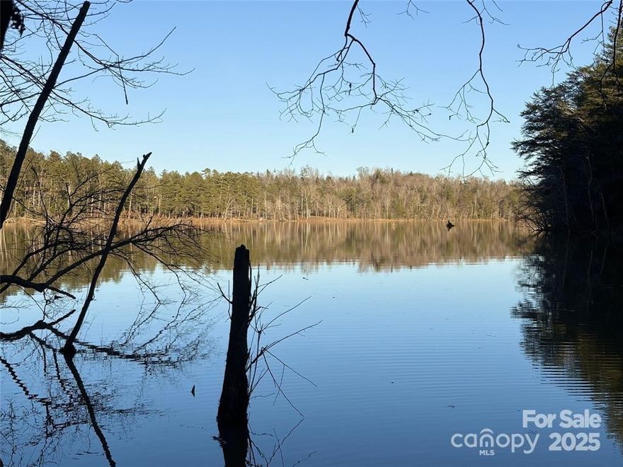 Discover the enchanting allure of a stunning 0.82-acre waterfront property nestled in the coveted “Lake Rhodhiss Estates.”
This exceptional lot boasts a distant view, providing a picturesque backdrop for your future dream home or vacation
retreat. The semi-clear landscape is adorned with beautiful hardwoods, ensuring a private and serene environment, perfect
for launching your canoe or kayak right from your own backyard. Located within a secure gated subdivision, this property is
a haven for lake lovers and outdoor enthusiasts alike. Imagine indulging in scenic boating, fishing, and exhilarating water
sports. Plus, enjoy effortless access to major highways, allowing you to explore the vibrant city of Charlotte, Asheville, and
the breathtaking Blue Ridge Mountains within a short one-hour drive. This rare opportunity is not to be missed. Embrace
the lifestyle you have always dreamed of on the tranquil shores of Lake Rhodhiss.