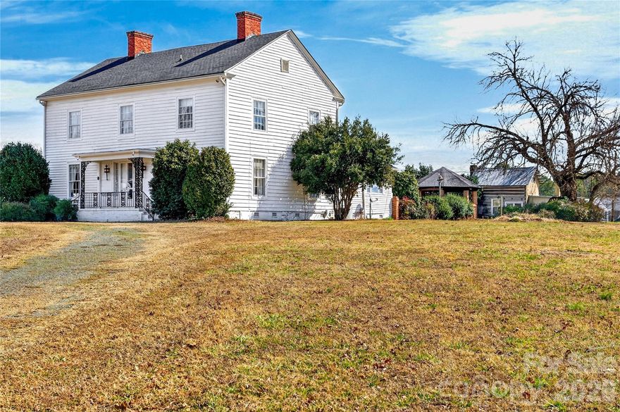 The Historic Edgewood Farmhouse is one of the last antebellum plantation homes still standing in Mecklenburg County. Carefully preserved, this circa 1840 farmhouse is the embodiment of the transitional Federal/Greek Revival style. It was built for Robert Davidson Alexander and his wife, Abigail Bain Caldwell Alexander, two prominent pioneer families in Mecklenburg County. Situated on 2.5 acres in a historic viewshed, this amazing property is conveniently located near 485, schools, shops and restaurants. The main house is your typical 4x4 with a center hall and a Kitchen addition; the rear porch was enclosed into a cozy sunroom. Interior features include heart pine and oak floors, 8 fireplaces with historic mantlepieces, high ceilings, beautiful millwork and historic architectural details. There is an original log home, built circa 1830, on the property, which includes a full bathroom and an exterior 1/2 bath. Endless opportunities! This historic landmark is an exceptional canvas poised to bring your design vision to life! The property zoning permits some commercial uses for farm and agriculture as well. Priced below recent appraisal!