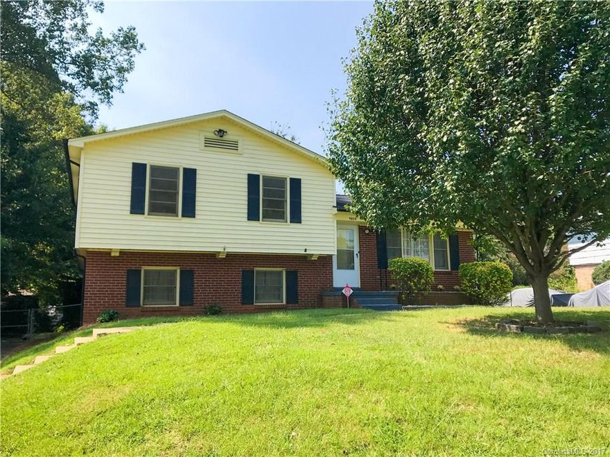 Gorgeous split level in desirable neighborhood! Fresh neutral paint throughout and brand new carpet downstairs. This single-owner property features the beautiful original hardwoods throughout. Hvac less than 2 years old. Lots of space with a bedroom and full bath off the den for in-laws or guests. Huge fenced in backyard with storage building wired for electric. Two driveways for plenty of parking. A must see!!!