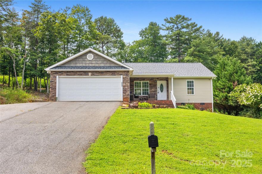 Back on the Market- NO FAULT OF SELLER!! Live near the lake on 1.53 peaceful acres! This charming ranch home is located in a lake access community w/a voluntary HOA ($100/year) that includes use of a private boat ramp, dock & picnic area on Lake Rhodhiss. The open floor plan features 3 bed/2 full bath, 1,334 sq. ft., vaulted ceilings, tons of natural light & wood/LVP flooring throughout. The spacious living room flows into the dining area & galley-style kitchen. The well-appointed kitchen features SS appliances, generous counter space, an abundance of cabinetry & a large picture window over the sink offering tranquil views of the backyard. Split-bedroom layout offers privacy w/a large primary suite, walk-in closet, and en suite bath w/dual vanities and a tub/shower combo. Two generously sized guest bedrooms. Laundry is tucked conveniently in the kitchen pantry. Step outside to a beautiful paver patio & partially wooded backyard~ perfect for relaxing or entertaining. Storage shed conveys. New Roof 2024, New Vapor barrier 2024.