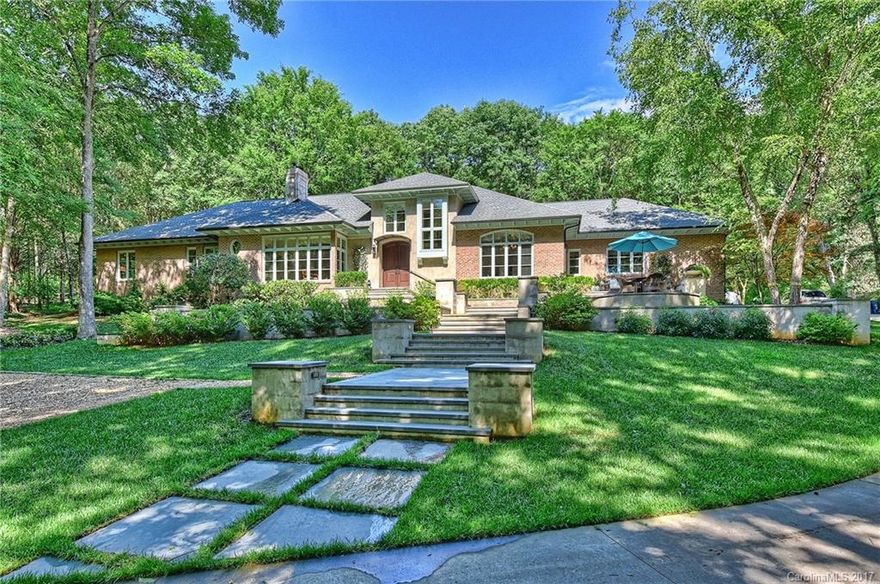 A unique custom built home in a private wooded setting, just 5 minutes from SouthPark. Renovated with a very open floor plan. High ceilings, hardwood floors, modern moldings, and views from every room. State-of-the art kitchen has a work island & breakfast bar. Stone terraces off the dining room make for perfect outdoor entertaining. Wet bar. Stone patio in back overlooks an acre of natural woods. Luxurious master suite has custom closet and new bath. Big rooms. Study w/fireplace. Huge rec room.