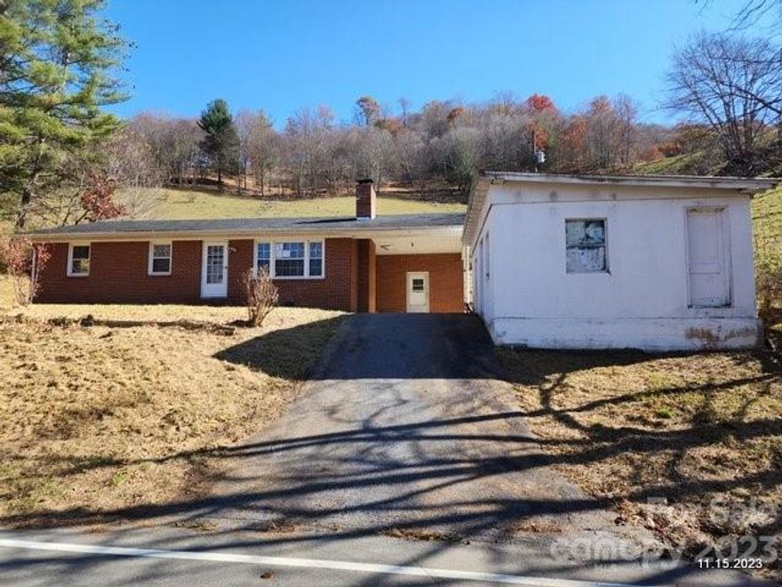 An internet real estate advertising business that starts with a Z says property has lead based paint and artist studio. Here are the facts...no lead based paint tests have been done - and detached building has not been set up as artist studio. Cozy brick ranch in mountain countryside near stocked trout streams of Helton Creek. 3 BR, 1.5 BA, 1120 Sq.Ft. one level home has attached single carport, paved drive. State maintained paved road frontage. About an acre borders open fields, overlooks valley, hills. Detached, large cinder block building could be workshop or convert to your needs - has flue for wood stove. Separate utility room with outside access at carport has pressure tank, water heater, laundry hook ups. Needs TLC, repairs. Some heat registers in house, but heat supply not found. Burst pipes, window replacement, more. Property may qualify for Seller Financing - seller financing not guaranteed. Septic permit not found. Well not located. SOLD AS IS.