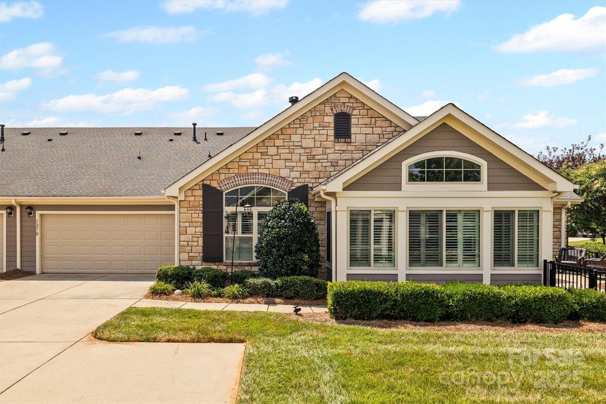 Immaculate & light-filled 2BR/2BA townhome offering comfort, style, low-maintenance living. Features include three Solatubes for abundant natural light without adding heat & desirable eastern exposure. The kitchen boasts custom cabinets, granite counters, & a deep sink with integrated cutting board & drying rack. The spacious primary bedroom features an en-suite bath & a walk-in closet. Secondary bedroom is perfect for guests or a home office. Enjoy the four-season sunroom—ideal for relaxing, reading, or entertaining. Elegant plantation shutters throughout, plus custom closets & a well-designed laundry room with utility sink & counter space. Attached two car garage with exterior keypad. HOA covers exterior maintenance & lawn care for true peace of mind. Community amenities include a clubhouse, pool, & beautifully maintained common areas. Ideally located near shopping, dining, recreation, & scenic hiking trails. A truly move-in ready home designed for easy, elegant living.