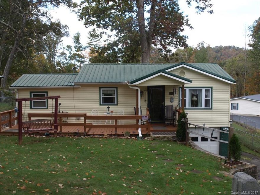 Perfect small home in the most convenient neighborhood.  Only 22 minutes to downtown Asheville and 17 minutes to downtown Waynesville. Large fenced back yard for pets with tool shed. Lots of upgrades and improvements including metal roof, vinyl siding, new windows, deck in front and back, tile in bath, two year old heatpump, new refrigerator, new stove.