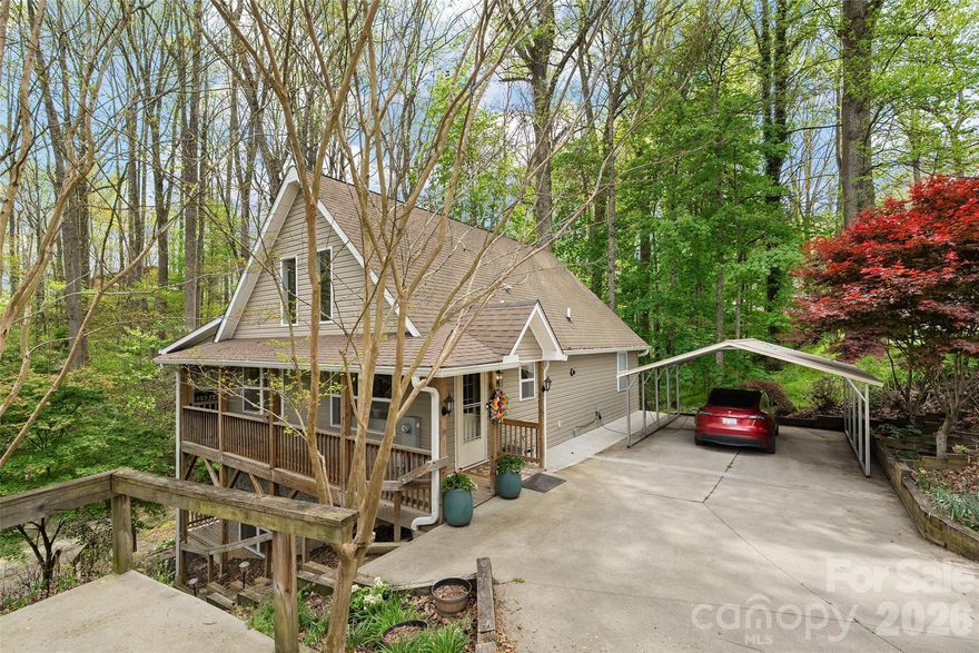 Ideally located just moments from the heart of Lake Junaluska, this versatile retreat offers the perfect blend of convenience, space, and income potential. Enjoy easy access to the lake, walking trails, and Stuart Auditorium, along with the rare opportunity to observe a nearby bald eagle nest right across the street—an unforgettable natural highlight.

The main level features an inviting open floor plan with vaulted ceilings and abundant natural light, creating a bright and airy great room that flows seamlessly into the kitchen and dining areas—perfect for entertaining. Flexible living options include multiple primary suites, with one on the main level and another upstairs overlooking the living space.

The lower level functions as a fully equipped apartment with its own entrance, living area, kitchen, bedrooms, and baths—ideal for short-term rental income, multi-generational living, or extended guests.

Outdoor living shines with covered and wraparound decks on both levels, providing inviting spaces to relax and enjoy the peaceful surroundings. Ample parking, including a carport and additional driveway space, adds to the home’s practicality.

Whether you're searching for a full-time residence, second home, or income-producing property, this home delivers exceptional flexibility in one of Western North Carolina’s most desirable lake communities—just minutes to Waynesville and a short drive to Asheville.